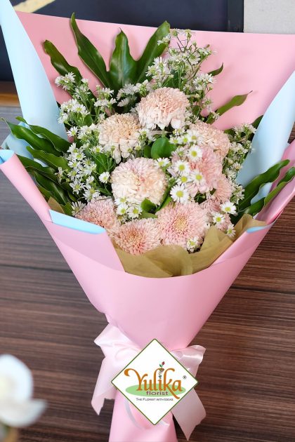 Flora Peach Carnation – Soft peach carnations with daisies in pink wrap | Yulika Florist Jakarta